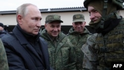 Predsednik Rusije Vladimir Putin i ministar odbrane Sergej Šojgu u centru za vojnu obuku u gradu Rjazan, 20. oktobra 2022. 