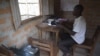 Severin Bavulo, a high frequency radio operator in Zemio, provides security information over the radio to surrounding communities. (VOA/Z. Baddorf)