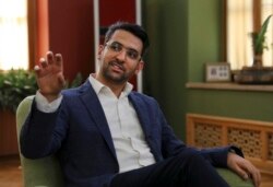 FILE - In this July 7, 2019, photo, Iran's telecommunications minister Mohammad Javad Azari Jahromi is seen duting and interview in Tehran. The U.S. Treasury on Nov. 22, 2019, sanctioned Jahromi over the internet shutdown in Iran.