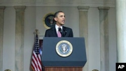President Barack Obama makes a statement on the resignation of Egypt's President Hosni Mubarak in the Grand Foyer at the White House, February 11, 2011