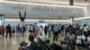 FILE - Travelers at London's Heathrow Airport, July 13, 2022. Global airline traffic was up from pandemic levels in 2022 and is expected to continue to grow. 