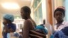 Women take children to the clinic