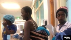 Women take children to the clinic