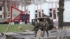 Ukrainian troops patrol Borodyanka, Ukraine, days after retaking the town from Russian soldiers, April 6, 2022. (Heather Murdock/VOA)
