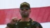 Pemimpin kelompok ekstremis sayap kanan Proud Boys Henry "Enrique" Tarrio mengenakan topi yang bertuliskan The War Boys dalam sebuah aksi di Portland, Oregon, pada 26 September 2020. (Foto: AP/Allison Dinner)