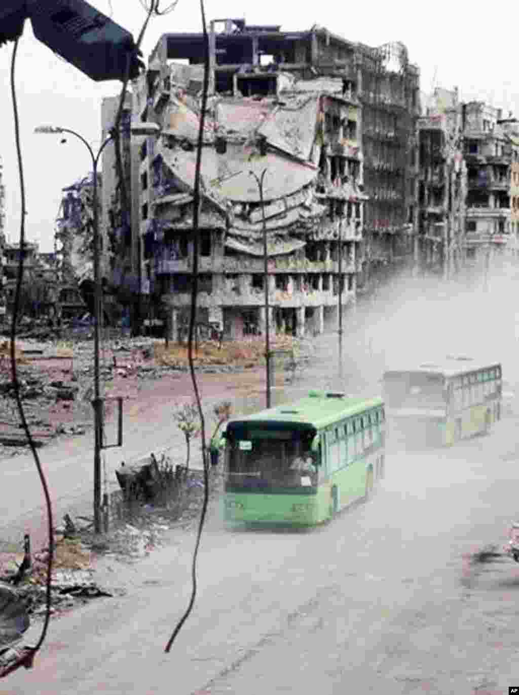 The exit of about 1,200 fighters and civilians marks a de facto end of the rebellion in the battered city of Homs, one of the first places to rise up against President Bashar al-Assad's rule, earning the nickname "capital of the revolution," Homs, May 7, 2014.