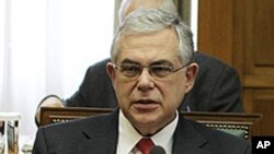 Greek Prime Minister Lucas Papademos attends a cabinet meeting at the Greek Parliament in Athens, March 9, 2012.