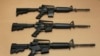 FILE -- Three variations of the AR-15 assault rifle are displayed in Sacramento, Calif. While the guns look similar, the bottom version is illegal in California because of its quick reload capabilities. Omar Mateen used an AR-15 that he purchased legally 