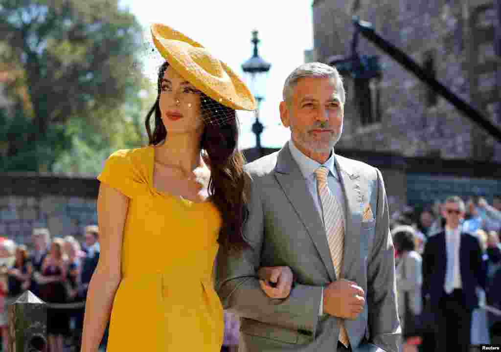 Amal Clooney and George Clooney arrive at St George's Chapel at Windsor Castle for the wedding of Meghan Markle and Prince Harry, May 19, 2018.