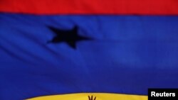 Una bandera venezolana durante un acto en Caracas.
