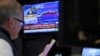 FILE - A trader works on the floor at the New York Stock Exchange, in New York, Dec. 14, 2022. 