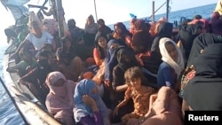 A boat carrying Rohingya refugees is seen stranded in waters off the coast of Bireuen, Aceh province, Indonesia, December 27, 2021, in this still image taken from a video. (Aditya Setiawan via REUTERS) 
