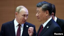 Rossiya rahbari Vladimir Putin va Xitoy rahbari Si Zinpin Shanxay Hamkorlik Tashkilotining Samarqanddagi sammitida, 16-sentabr, 2022