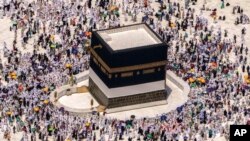 Muslim pilgrims walk around the Kaaba, the cubic building at the Grand Mosque, during the annual hajj pilgrimage, in Mecca, Saudi Arabia, on July 10, 2022.