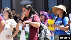 FILE - Gloria Cazares, mother of Jackie Cazares, who was killed in Robb Elementary School shooting in Uvalde, Texas, listens to speakers during a "March for Our Lives" rally in Austin, Texas, June 11, 2022.