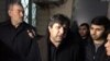 FILE - Avaz Zeynalli, center, owner and chief editor of the independent news outlet Xural TV, is seen in this undated photo.