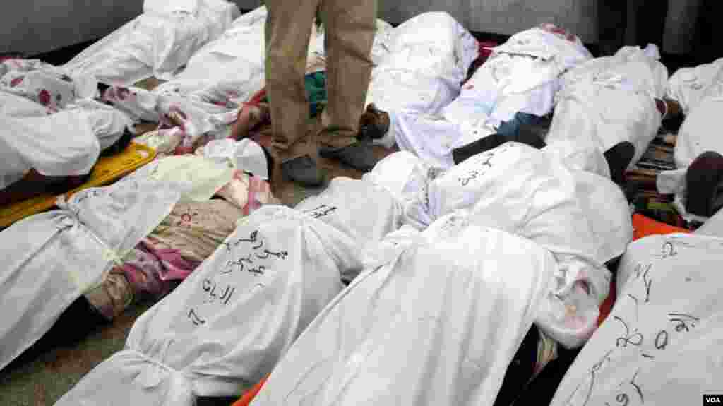 Bodies of Morsi supporters killed early Saturday in clashes with security forces are seen in a makeshift morgue in Cairo, July 27, 2013, (Elizabeth Arrott/VOA).