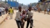 FILE - A man injured in an explosion at an M23 rally is evacuated from the scene in Bukavu, Democratic Republic of Congo, on Feb. 27, 2025. The Angolan government said on March 12, 2025, that the M23 rebels and the DRC government will enter direct peace talks.