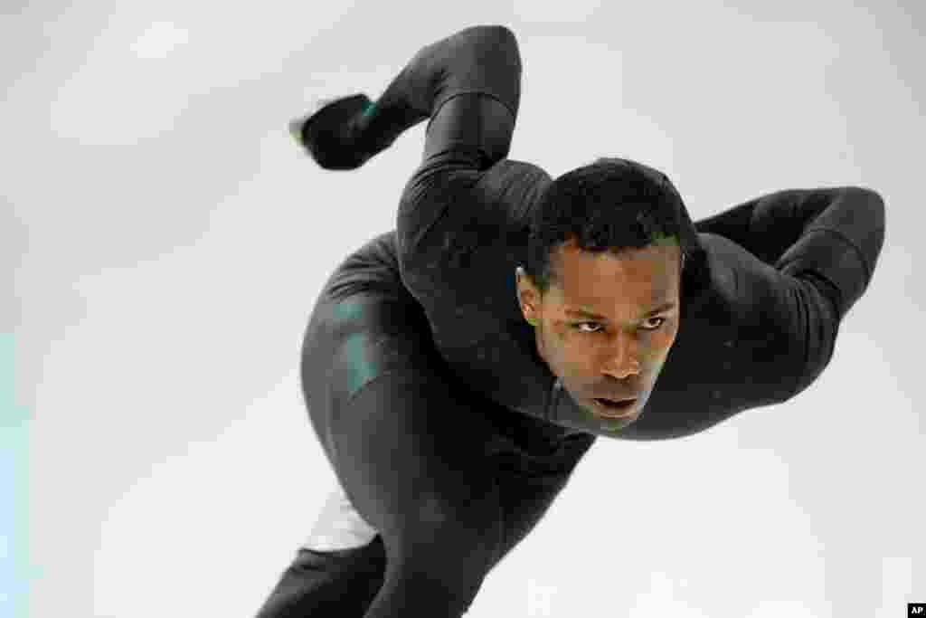 Shani Davis of the U.S. skates in the prototype of the official US Speedskating suit during a training session at the Adler Arena Skating Center at the 2014 Winter Olympics, Feb. 14, 2014.