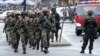 FILE - Liberian army soldiers walk on the Monrovia bridge during a training excercise as the United Nations Mission in Liberia forces (UNMIL) finally hands back security to Liberia's military and police, in Monrovia on June 24, 2016.