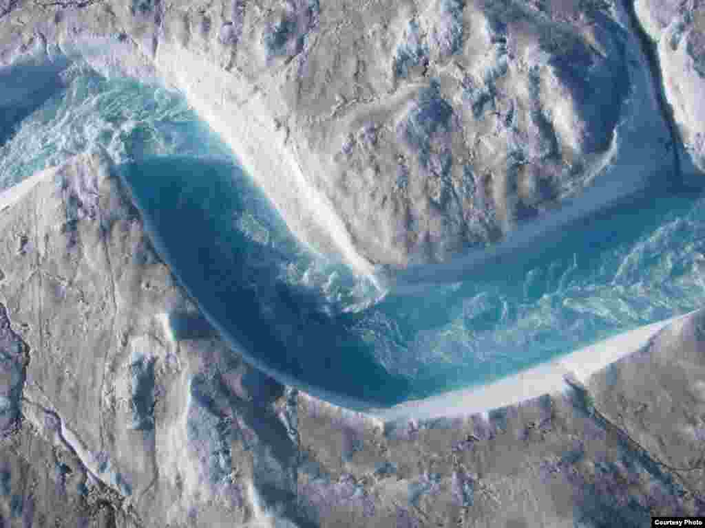 The rivers and streams that carry glacial meltwater across Greenland’s ice sheet are a beautiful shade of blue, but the water moves so fast and drains so unpredictably into moulins or sinkholes that researchers needed to use a range of high-tech instruments to get their measurements. (UCLA/Laurence C. Smith)