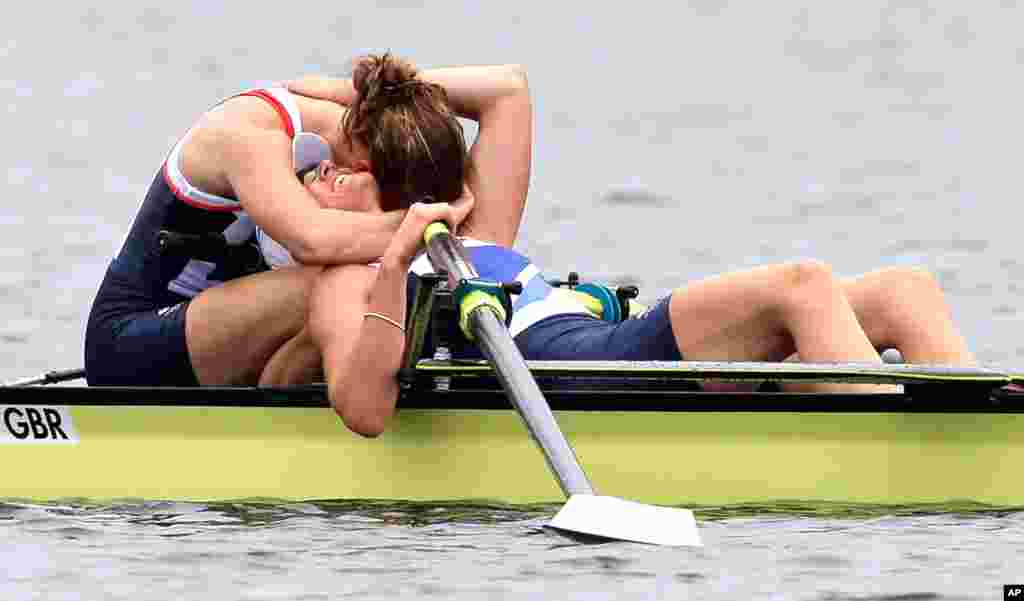 Great Britain's Heather Stanning and Helen Glover celebrate after winning the gold medal for the women's rowing pair in Eton Dorney.