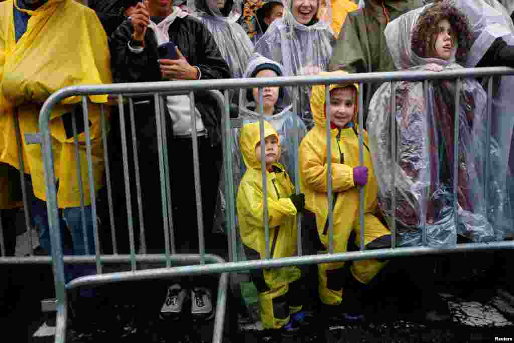 Attendees await the start of the annual Macy's Thanksgiving Day Parade in New York City, Nov. 28, 2024.