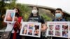 FILE - People protest in front of the Bolivarian National Intelligence Service (SEBIN) headquarters, seeking freedom for political prisoners during the visit of the International Criminal Court's Prosecutor Karim Khan, in Caracas, Venezuela, Nov. 3, 2021.