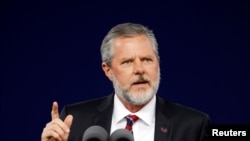 FILE - Liberty University President Jerry Falwell Jr. speaks during the school's commencement ceremonies in Lynchburg, Virginia, May 11, 2019.