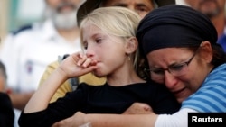 Relatives and friends mourn during the funeral of Hallel Yaffa Ariel, 13 — an Israeli girl who was killed in a Palestinian stabbing attack in her home in the West Bank settlement of Kiryat Arba — at a cemetery in Hebron, June 30, 2016.