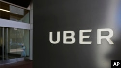 FILE - An exterior view of the headquarters of Uber is seen in San Francisco, March 1, 2017. Toyota will sink a half-billion dollars into Uber and work jointly with the ride-hailing giant to develop self-driving vehicles. 