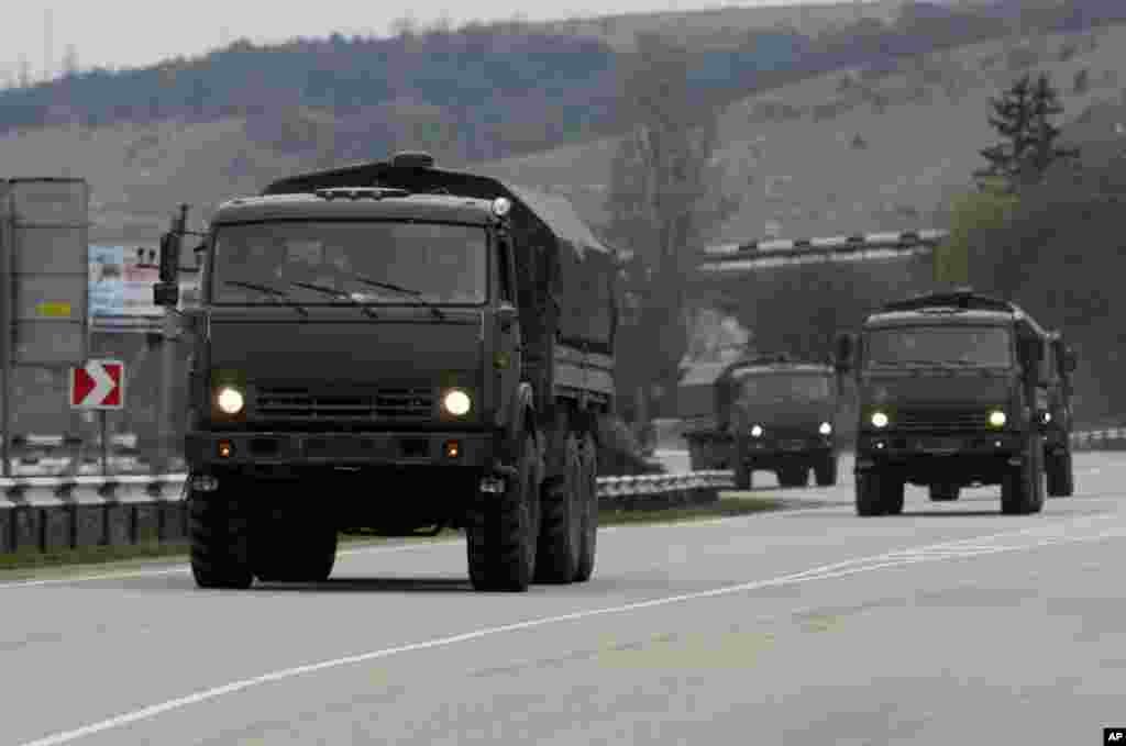 A convoy of hundreds of Russian troops headed toward the regional capital of Ukraine's Crimea region, a day after Russia's forces took over the strategic Black Sea peninsula without firing a shot. Pictured here, a Russian convoy moves from Sevastopol to Sinferopol in the Crimea, Ukraine, March 2, 2014. 