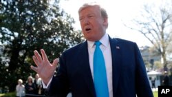 President Donald Trump speaks to members of the media on the South Lawn of the White House in Washington, before boarding Marine One helicopter, April 10, 2019.