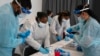 Biden Disagrees with Former Advisers who Urge Americans to Live with the Coronavirus 