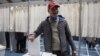Lars Jorgen Kleist, wearing a MAGA hat, casts his vote during the general election in Nuuk, Greenland, March 11, 2025. 