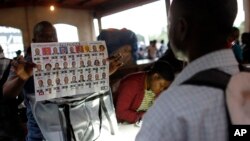 FILE - Electoral workers count ballots at a polling station in Port-au-Prince, Haiti, Nov. 20, 2016.