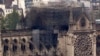 Notre Dame cathedral is pictured from the top of the Montparnasse tower, April 16, 2019, in Paris, France. Firefighters declared success Tuesday morning in an over 12-hour battle to extinguish an inferno engulfing Paris' iconic cathedral.