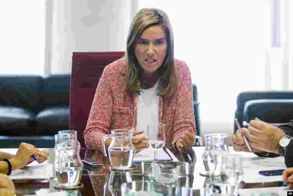 Spainish Health Minister Ana Mato speaks during a meeting between authorities of the Health Ministry and the Madrid Regional Health Council in Madrid, Spain, Oct. 7, 2014.