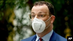 German Health Minister Jens Spahn arrives for a press conference in Berlin, Germany, Wednesday, May 12, 2021. (AP Photo/Michael Sohn)