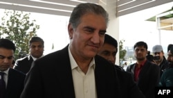 FILE - Pakistani Foreign Minister Shah Mehmood Qureshi arrives to attend a joint session of parliament in Islamabad on Feb. 28, 2019. 