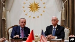 Vice President Mike Pence meets with Turkish President Recep Tayyip Erdogan at the Presidential Palace for talks on the Kurds and Syria, Thursday, Oct. 17, 2019, in Ankara, Turkey. (AP Photo/Jacquelyn Martin)