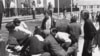 A Kent State University student lies on the ground after National Guardsman fired into a crowd of demonstrators on May 4, 1970 in Kent, Ohio. (AP Photo)