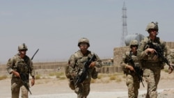 FILE - U.S. troops patrol at an Afghan National Army (ANA) Base in Logar province, Afghanistan, Aug. 7, 2018.