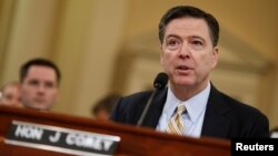 FILE - FBI Director James Comey testifies before the House Intelligence Committee hearing into alleged Russian meddling in the 2016 U.S. election, on Capitol Hill in Washington, March 20, 2017.