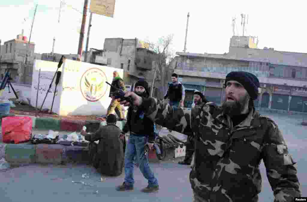 Free Syrian Army fighters are deployed in Kadi Askar in Aleppo after they claimed that they seized it from the Islamic State in Iraq and the Levant, Jan. 7, 2014.