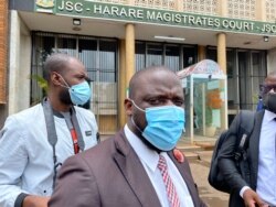 Paidamoyo Saurombe, from Zimbabwe Lawyers for Human Rights, talks to reporters outside Harare Magistrate's Court, Jan. 14, 2021. (Columbus Mavhunga/VOA)