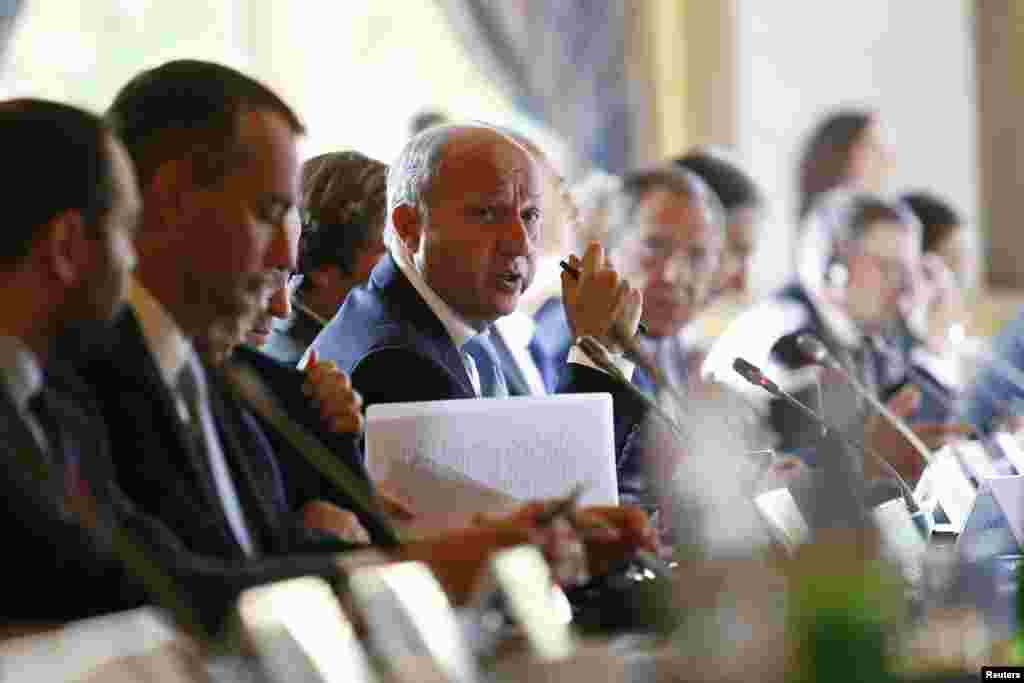 France's Foreign Minister Laurent Fabius (center) attends the International Conference on Peace and Security in Iraq, at the Quai d'Orsay in Paris, Sept. 15, 2014.