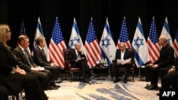 TOPSHOT - National Security Advisor Jake Sullivan (2nd L), US Secretary of State Antony Blinken (3rd L) and US President Joe Biden (4th L) listen to Israel's Prime Minister Benjamin Netanyahu as they join a meeting of the Israeli war cabinet in Tel Aviv