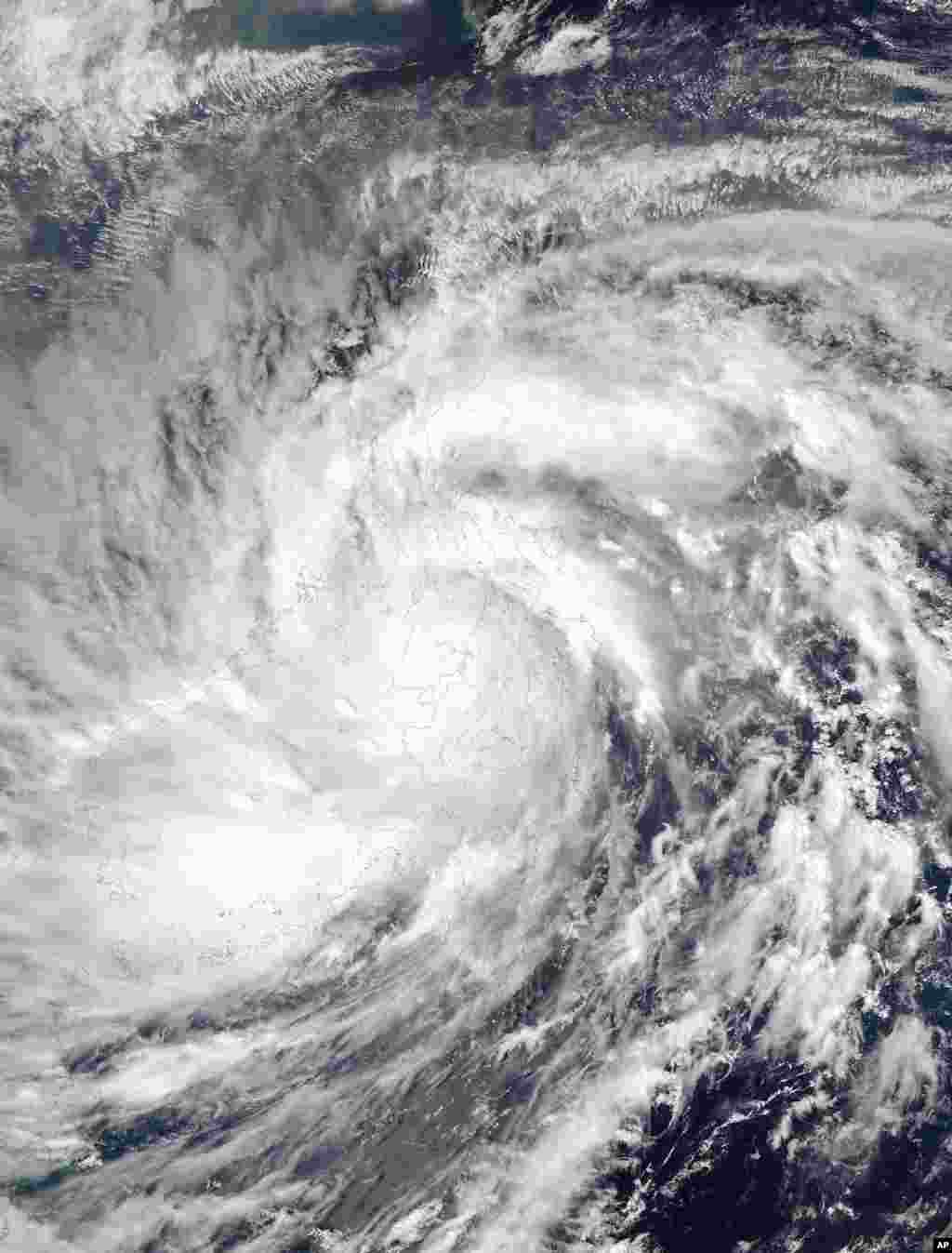 This image provided by NASA shows Typhoon Haiyan taken by the Aqua satellite as it passed over the Philippines, Nov. 8, 2013.