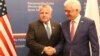 U.S. deputy secretary of state, John Sullivan, right, shakes hands with Polish Foreign Minister Jacek Czaputowicz in Warsaw, Poland, Wednesday, Dec. 19, 2018.